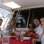 Friends dining on a yacht